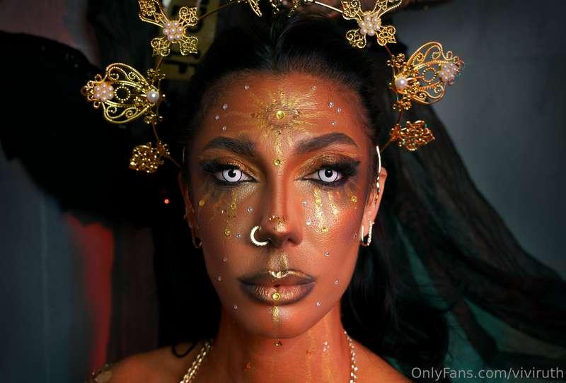Gold Goddess pierces your soul with her mesmerizing eyes and..