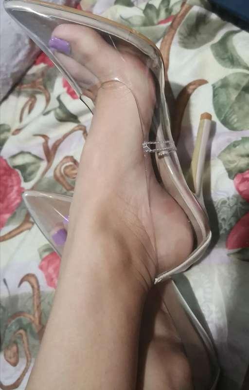 Cute feet in transparent heels