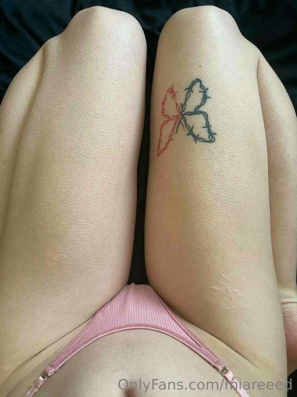 In this photo I show my pink panties and a tattoo on my thig..