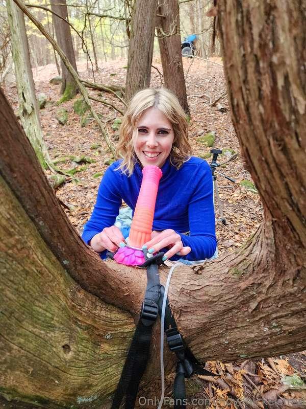 ***Fucking a large dildo attached to a tree with both holes*..