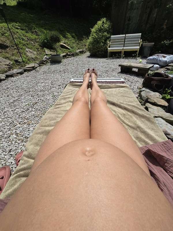 Me and my growing belly catching some sun 🌞  My little belly..