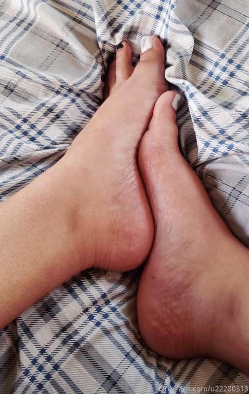 Talking to my mom on the phone. Thought my feet looked cute...