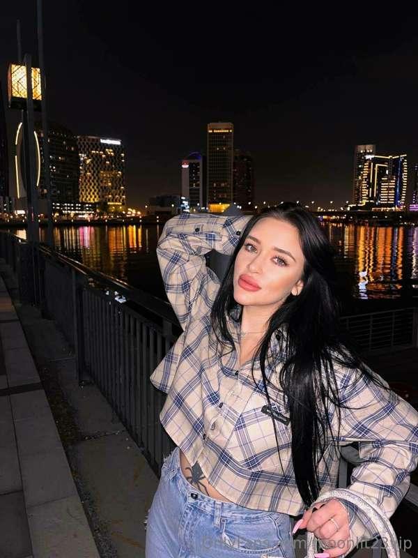 Striking a playful pose on the city promenade, where urban e..