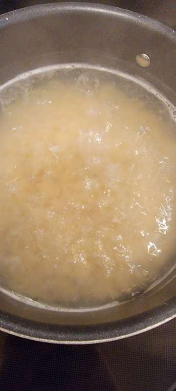 Cooking supper: baked chicken,  mac-n-cheese, and French gre..