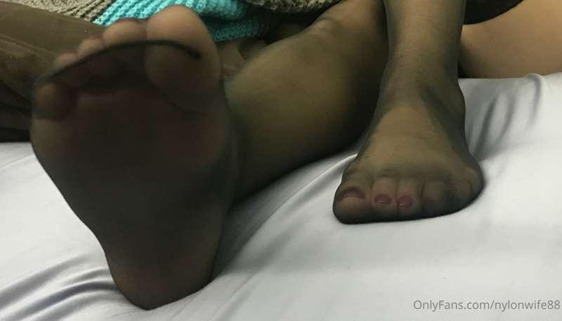 A few classic Black Stocking with red nail polish