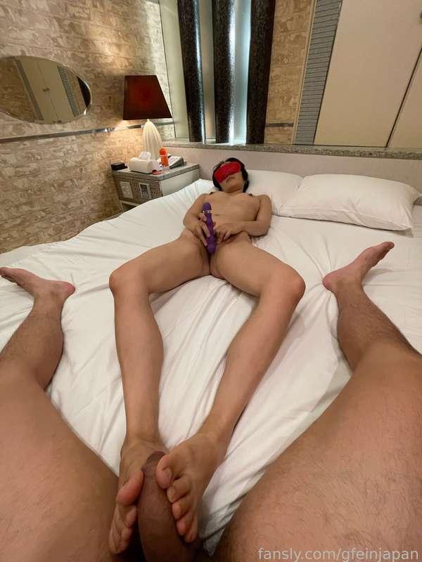 I am playing with toys while massaging his banana with my feet