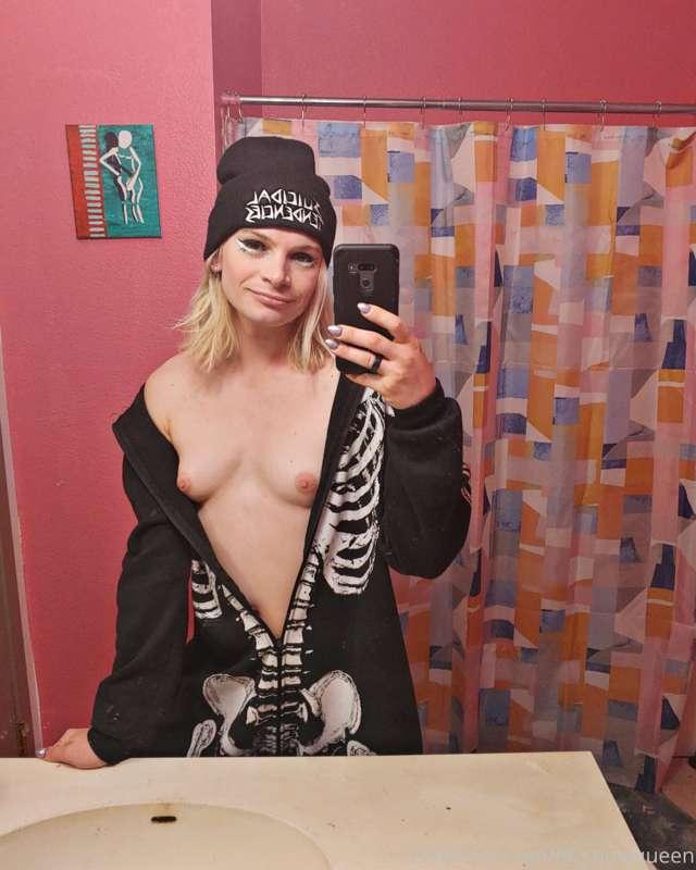 Titties peaking from my skeleton onsie.