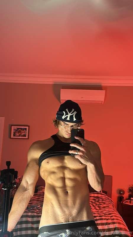 Sando lifted to show off these abs, cock straining in my box..