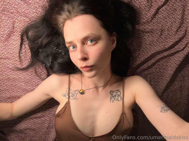 Lying back with a dreamy expression, feeling the calm settle..