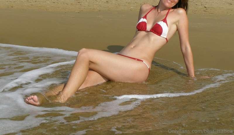 I am enjoying the sun, the beach, the sand, the sea.