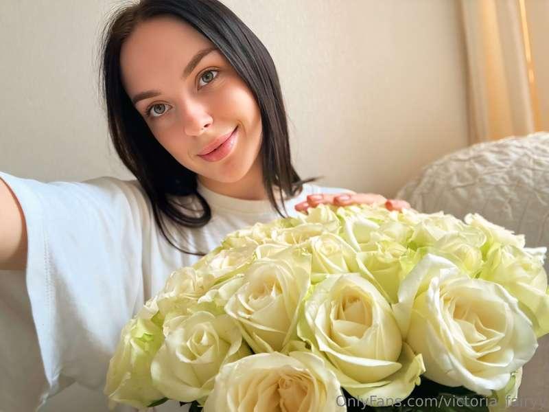 holding a bunch of roses on a cloudy day — flowers can fix a..