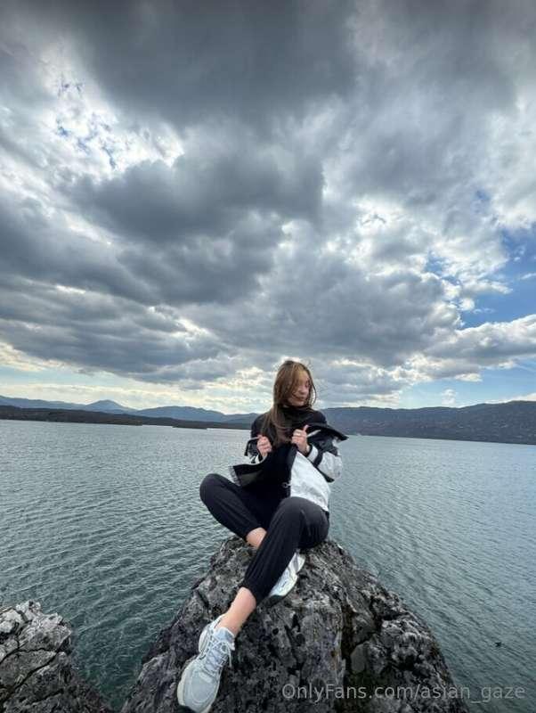 Amidst the brooding embrace of the sea, I stand, a solitary ..