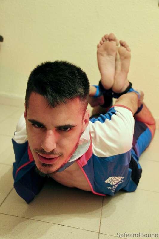 Hogtied and tape gagged, trying to break free…