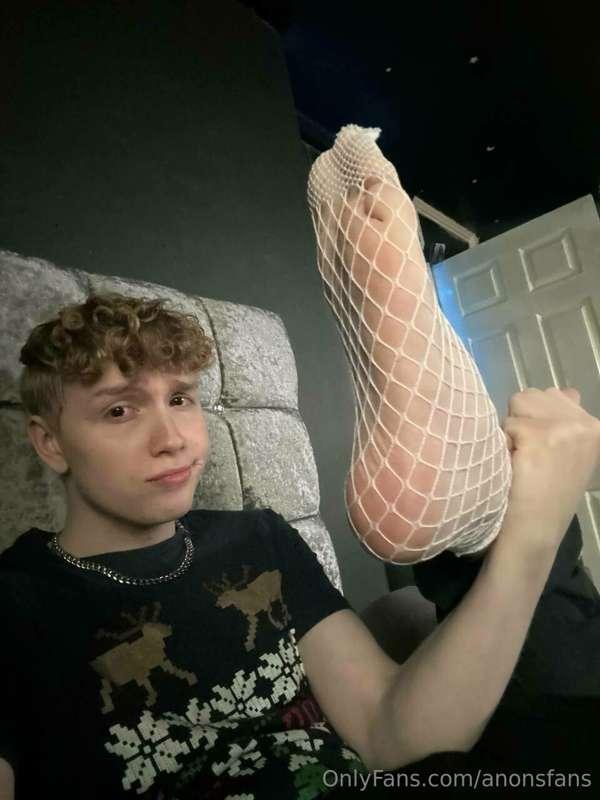 Christmas shirt and fishnet socks, wild combo 🤭