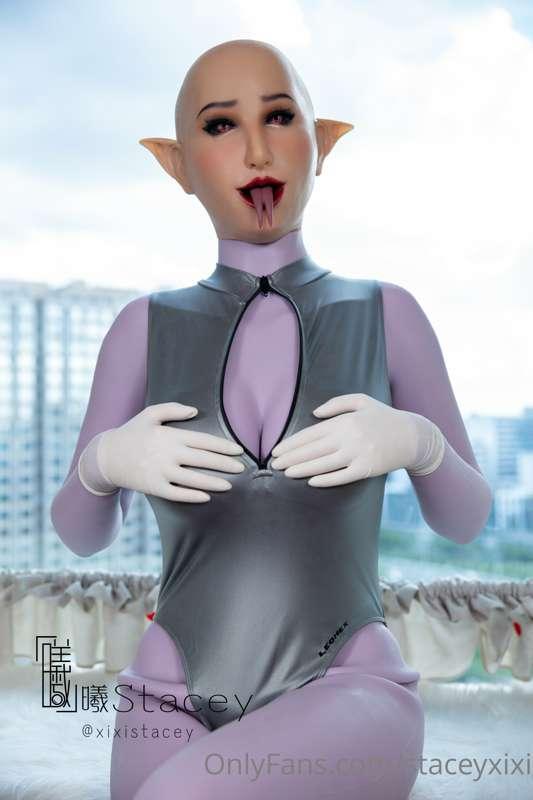 Female mask with purple silicone bodysuit 
In swim jumpsuit ..