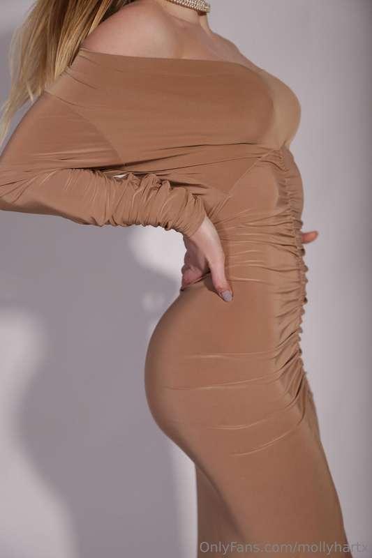 A tight-fitting dress hides only a small part of what can be..