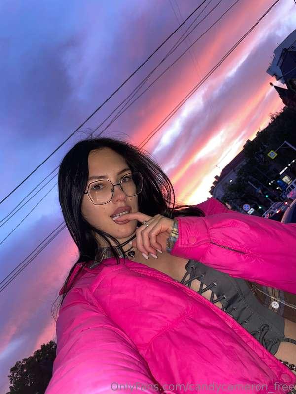 The sky above is a canvas of vivid hues, painted with soft g..