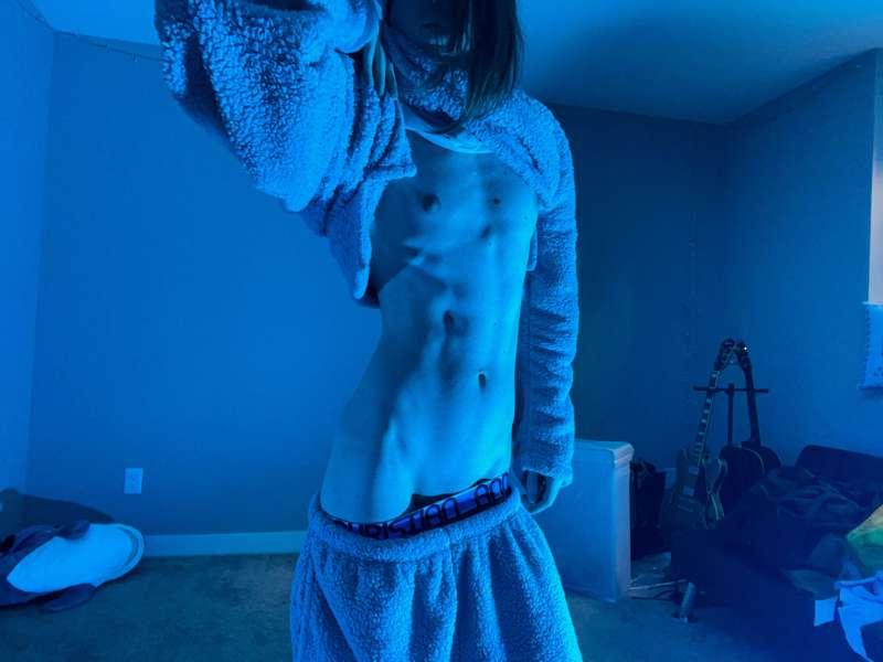 Cute hard toned boi shows off his tummy and stroking himself..