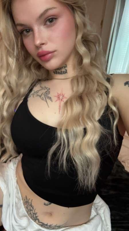 Dressed like a doll with a mind full of fantasies and a mout..