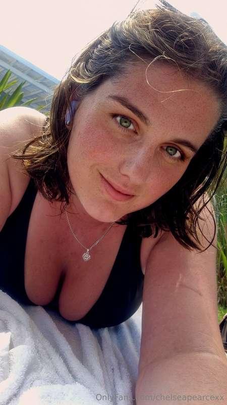 Laying out in the sun, glistening in oil and barely covered ..