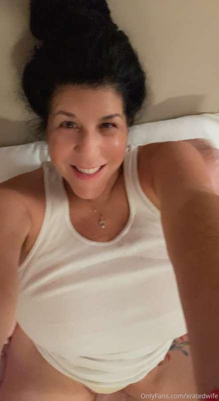 I love wearing wife beater T-shirts. My hairy pussy is looki..