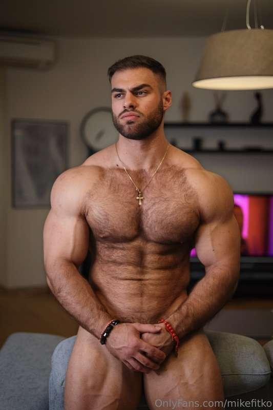 Standing tall, fully naked, just my hands hiding the cock wa..