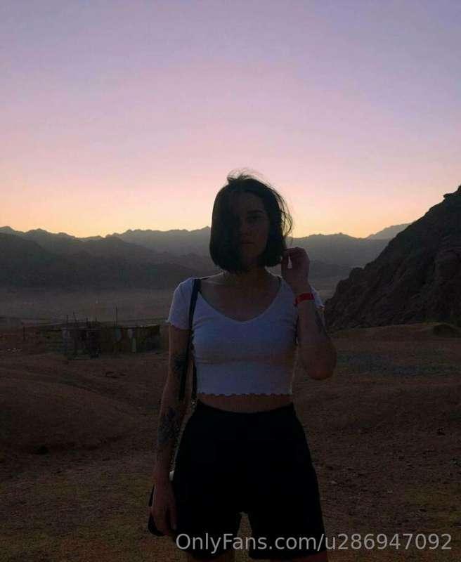 Fluffy clouds floated in the azure sky like sheep playing hi..