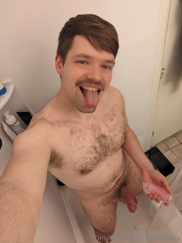 Stick out that tongue and slide a toy on that cock