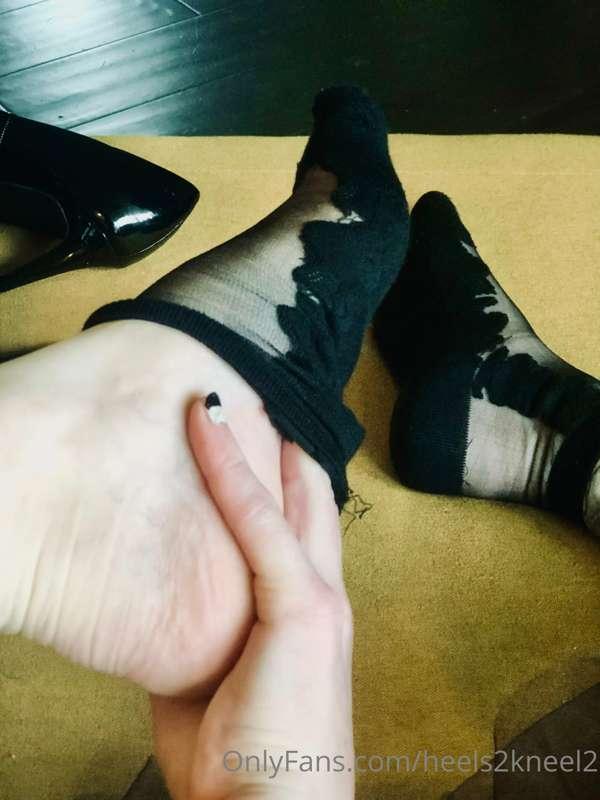Silky embroidered black stocking socks come off: resting on ..
