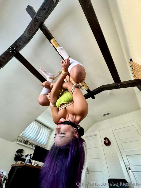 From the front gagged and suspended upside down