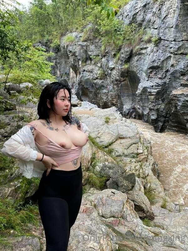 Topless, at the waterfall, I think it's beautiful hehe 👅