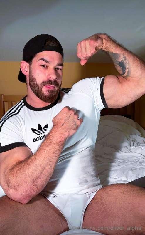 Clothes on, but barely keeping it together bicep flex tight,..