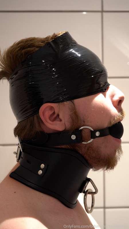 Simple setup, strict collar, ball gag and a "hat" of plastic..