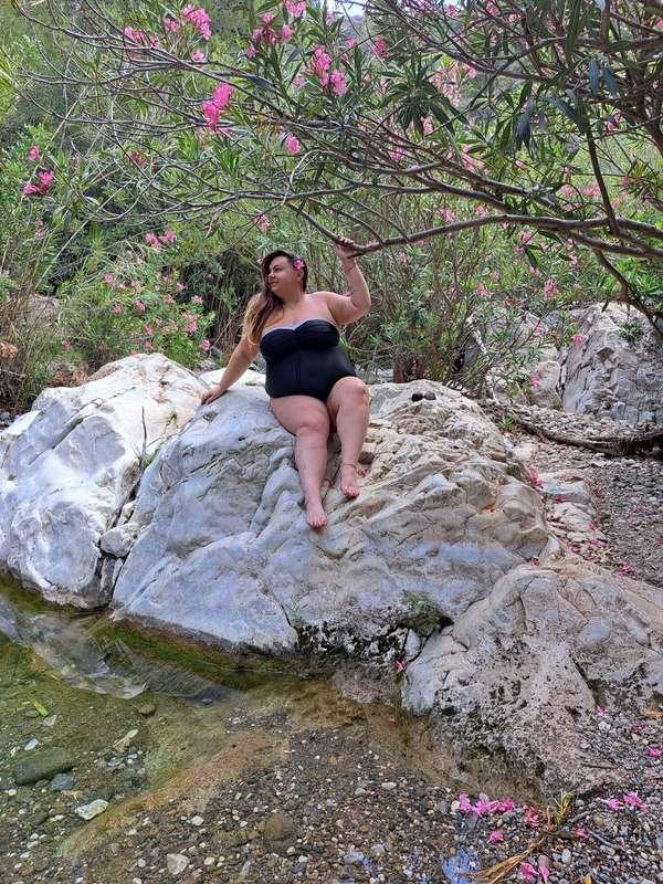 We were in the backyard, surrounded by tall trees and colorf..