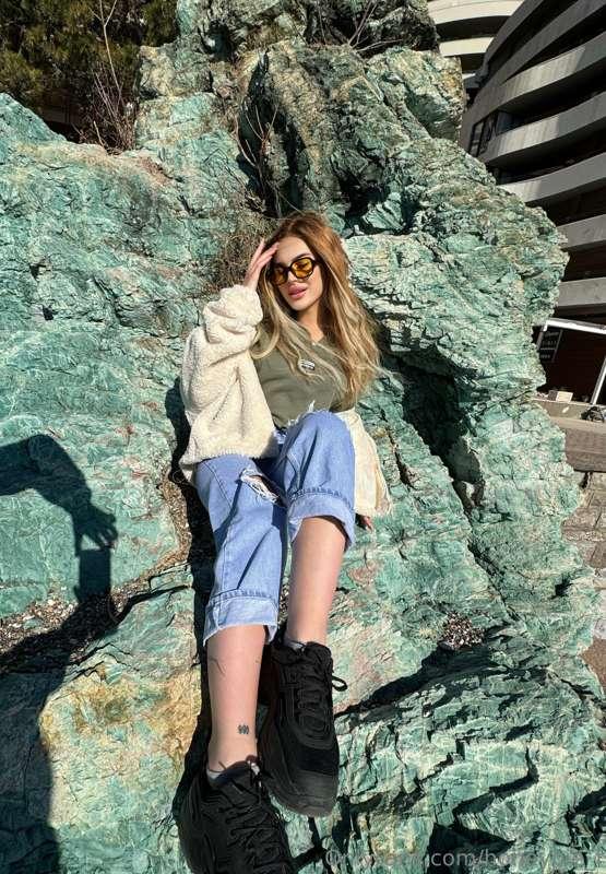 Perched on the rocks by the sea, soaking in the serenity of ..