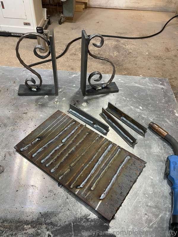 made these in my welding class! two book ends with iron hear..