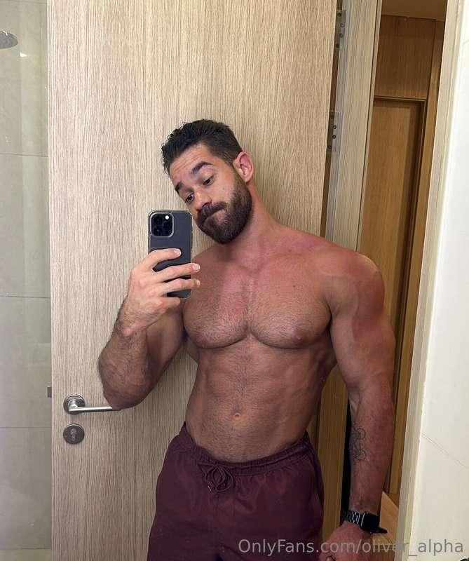 Caught in the mirror, shorts tight and cock standing proud i..