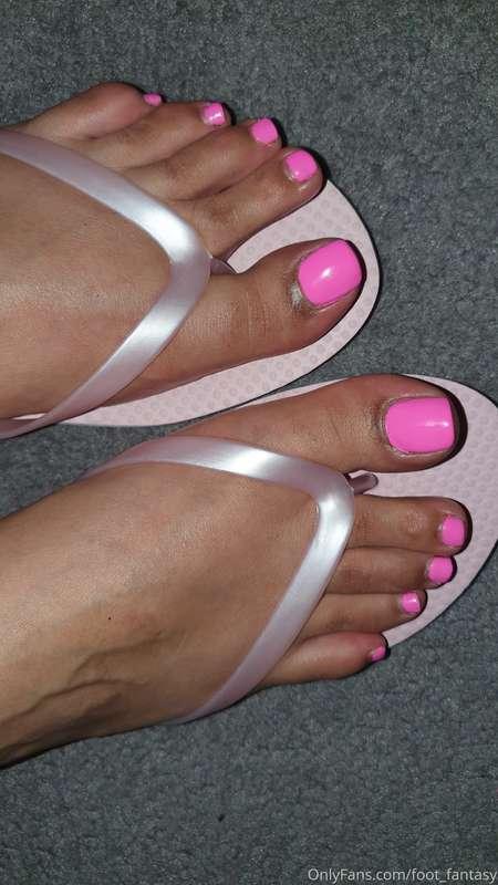 Baby pink flip flops