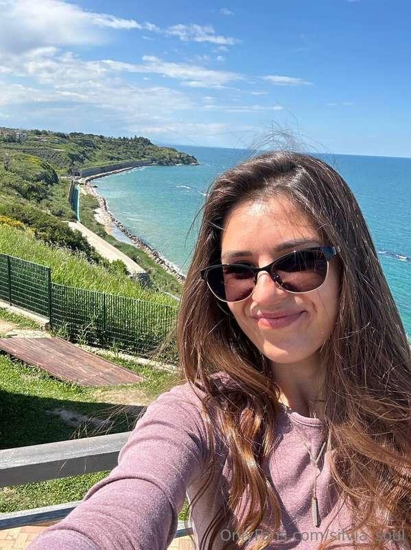 I stand between the sky and the sea, as if I had decided to ..