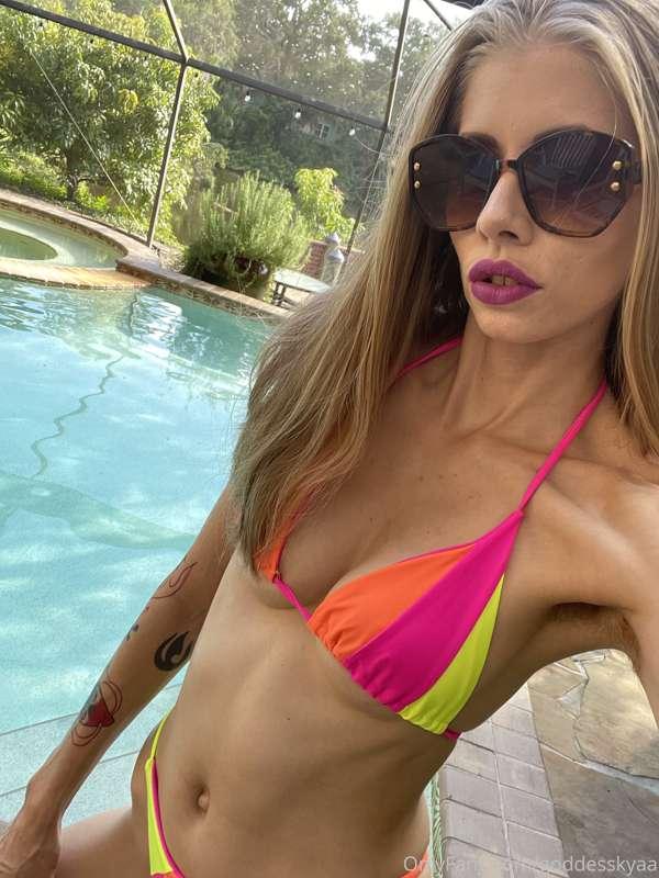 Today’s bikini is bright shades of pink, yellow and orange. ..