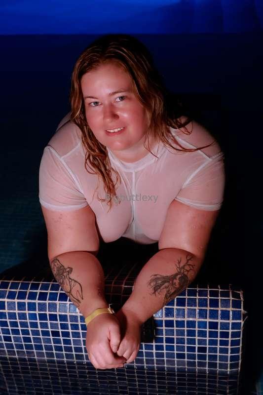 Wet white dress in the pool