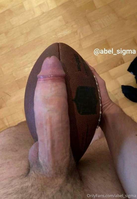 Comparing my cock again. This time with my rugbyball. Almost..
