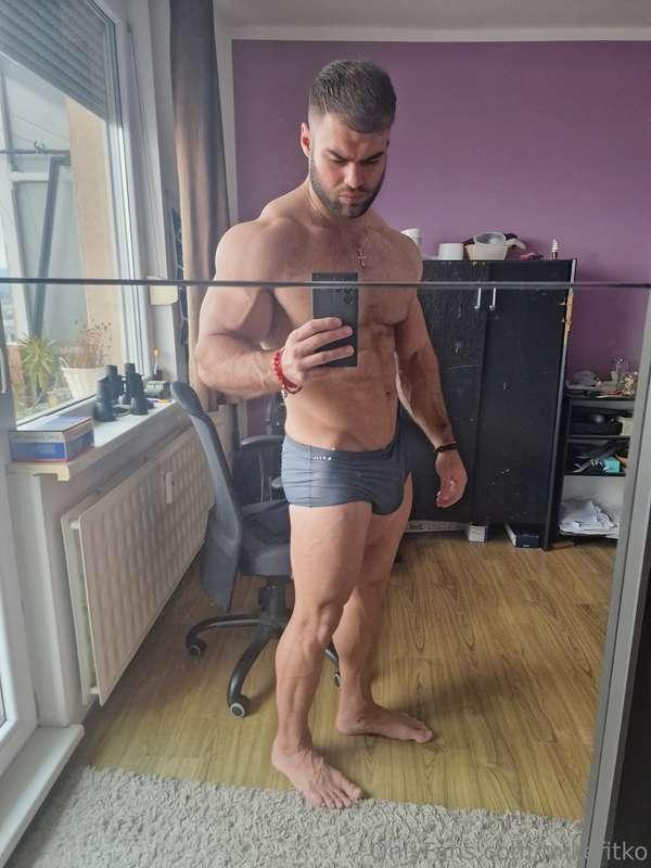 Snapping this shot… abs tight, cock straining in my boxers h..