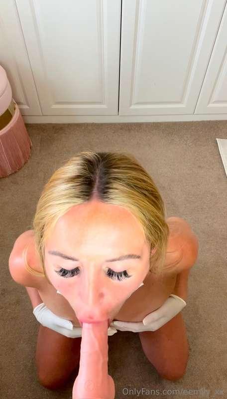 Pulling my mask down & sucking my dildo, spitting on my tits..