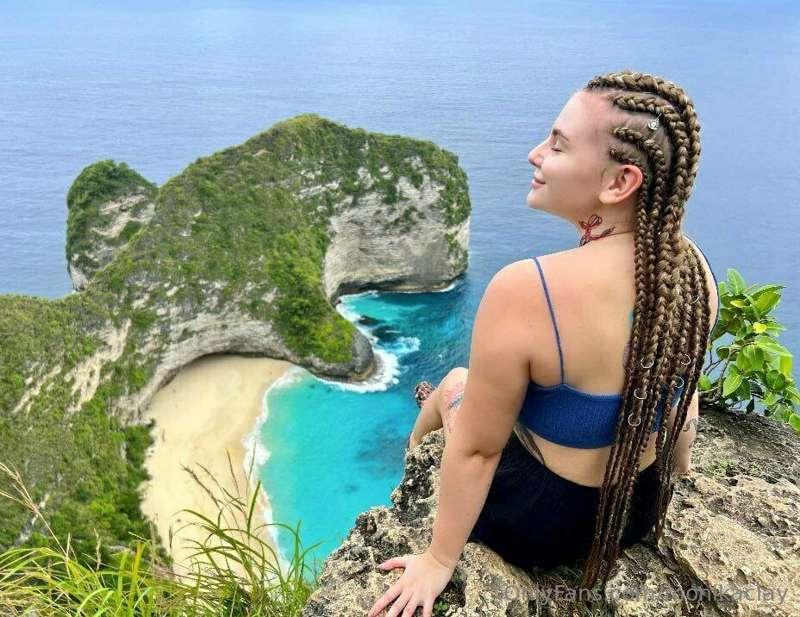 At the top of the mountain, I stand feeling the heat of pass..