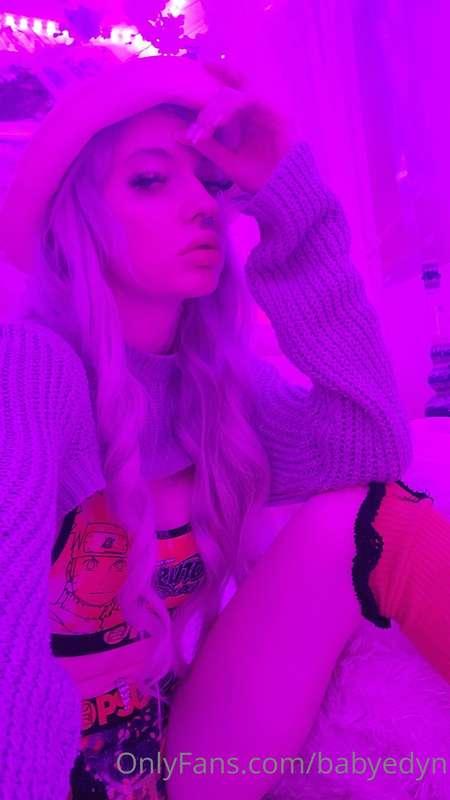 In the spotlight, playing the role of a seductive enchantres..