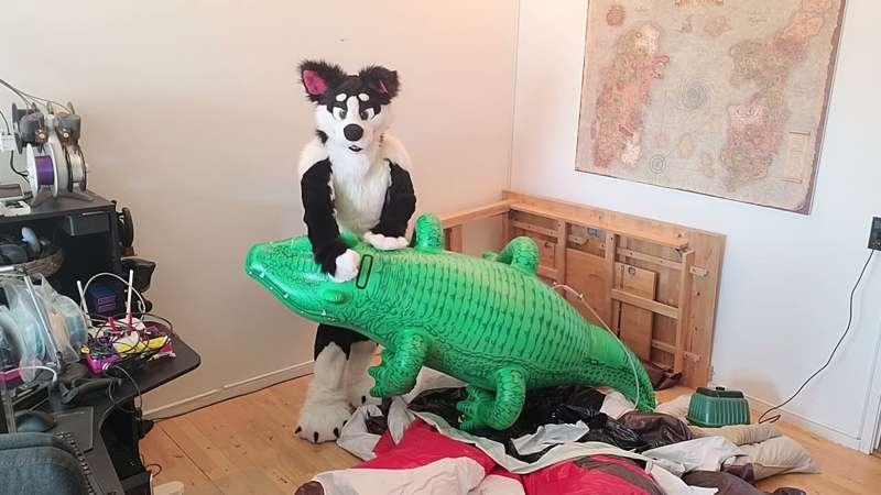 Mason blowing up a  crocodile.