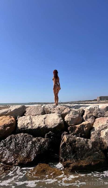 The sea stretches to the horizon, merging with the sky in de..
