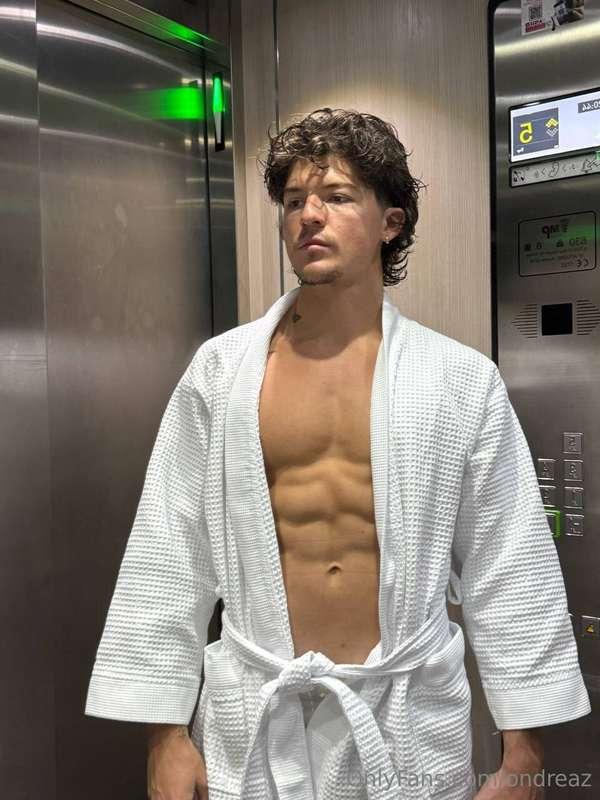 Elevator selfies hit different when the robe’s barely hangin..