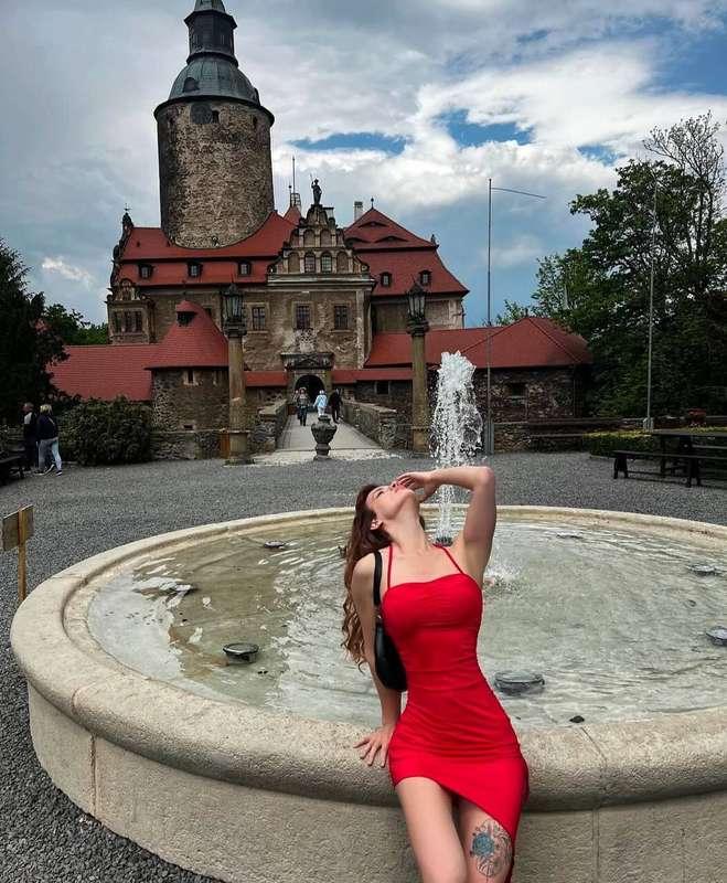 The fountain plays with crystal jets, filling the air with f..